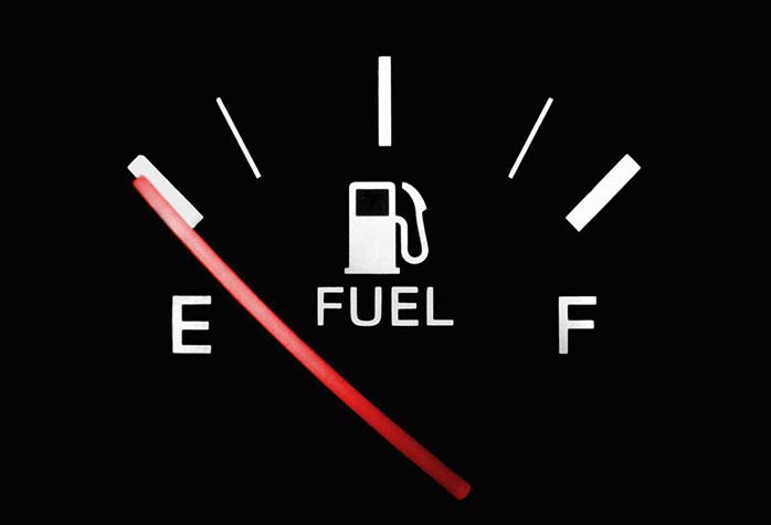vehicle petrol level gauge indicating fuel tank is empty
